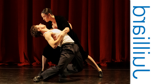 two dancers performing on stage